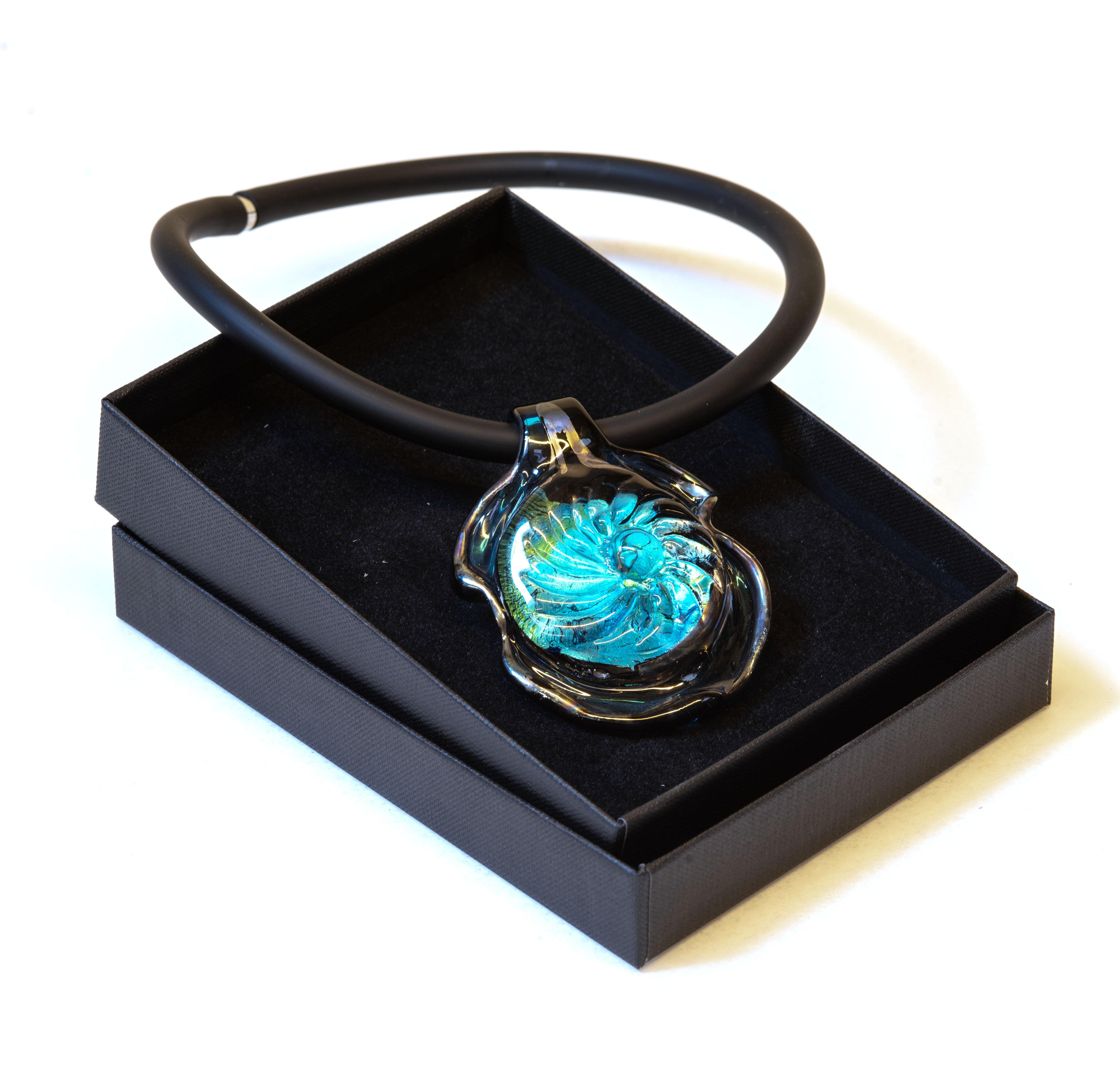 Handmade Murano glass pendant necklace with aquamarine center, silver foil and iridescent black rim, on black rubber cord