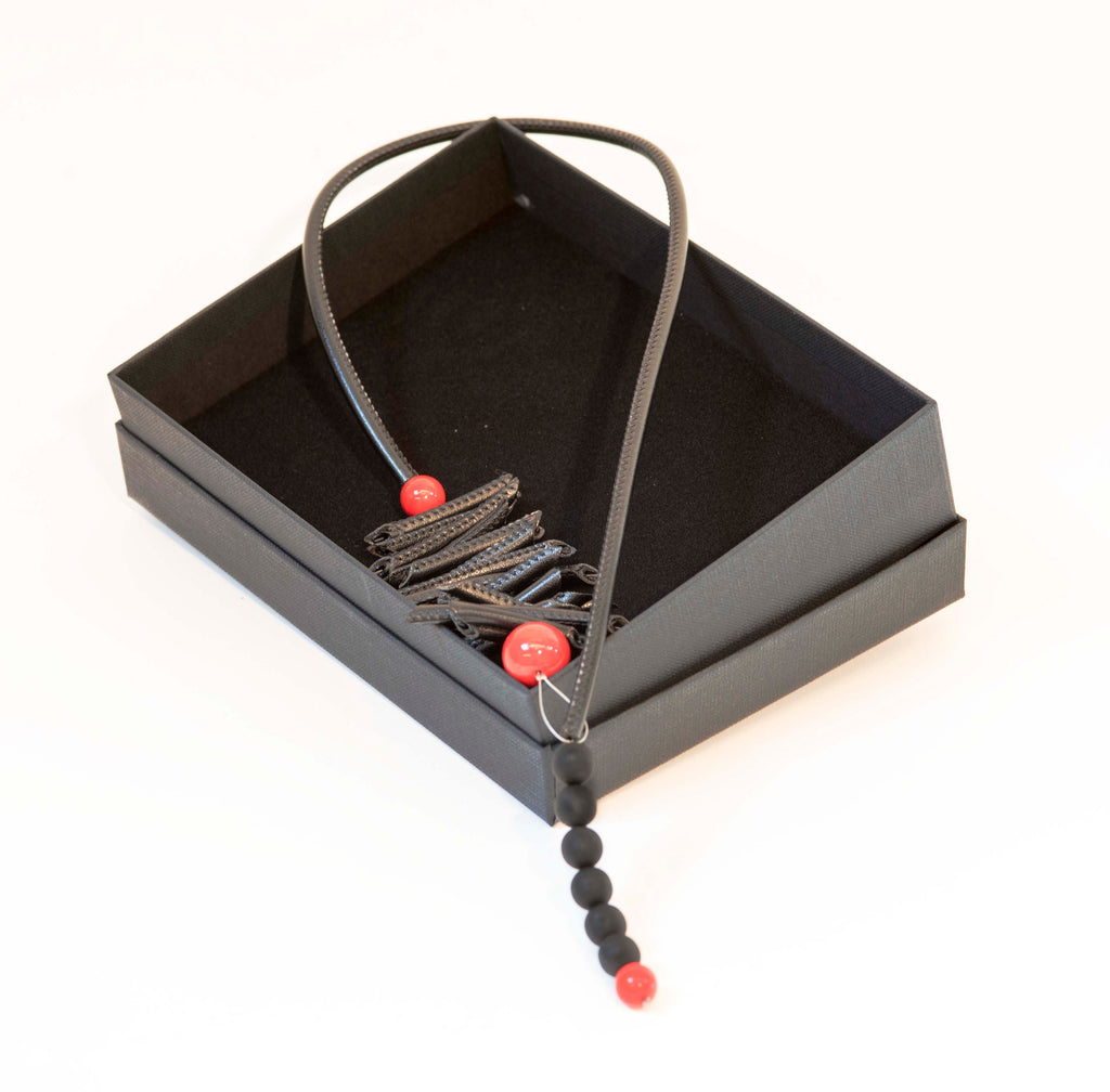 Necklace made of leatherette tube and glass pearls. Made entirely by hand by Cesare Sent in the Studio Glass of Murano.Refined jewel