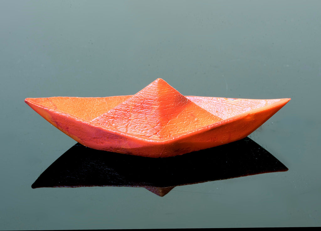 Paper boat in Murano glass. Realistic realization in glass.Sculpture of the glass master. Paper boat imitation. Paperweight glass made.