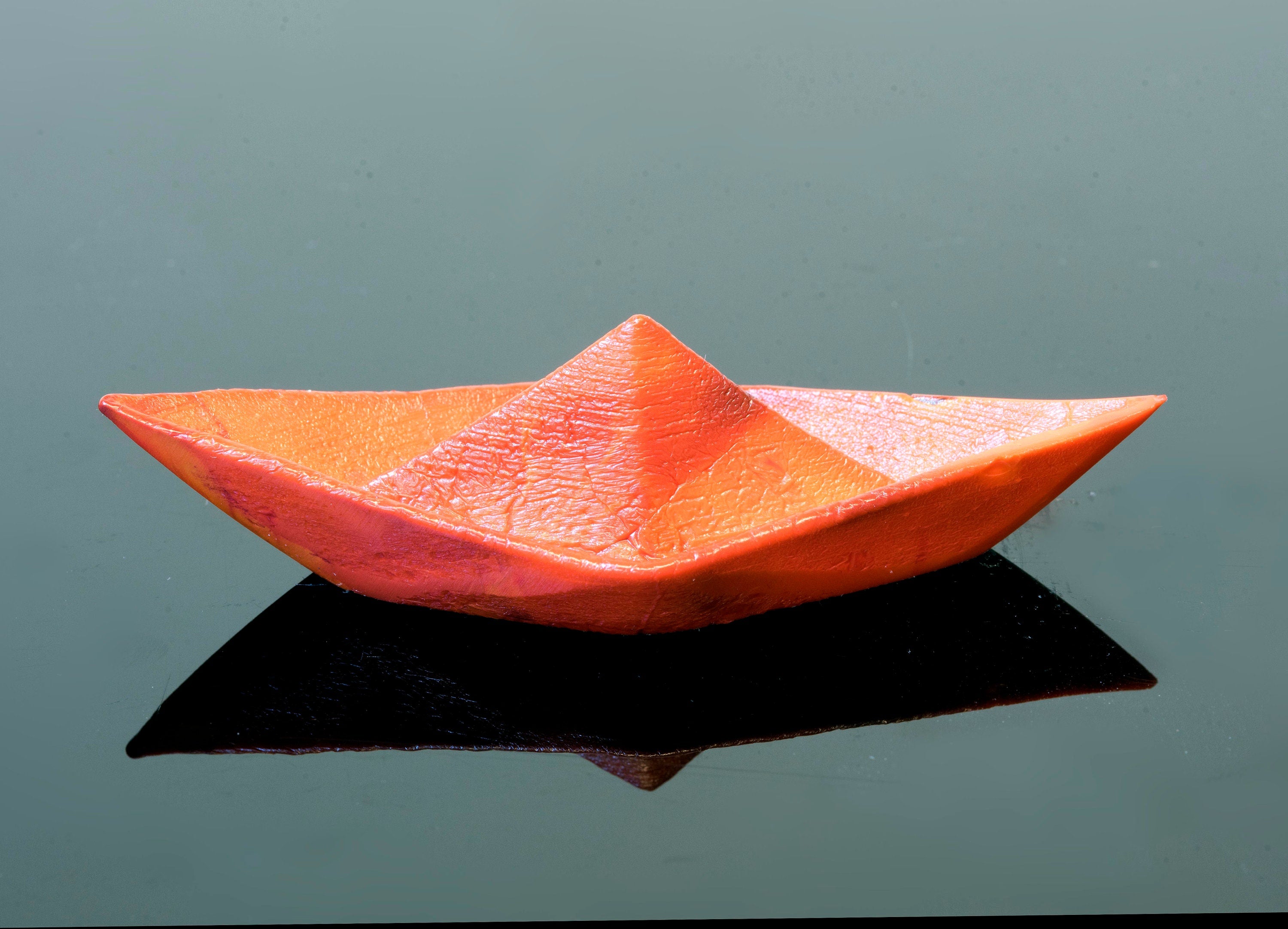 Paper boat in Murano glass. Realistic realization in glass.Sculpture of the glass master. Paper boat imitation. Paperweight glass made.