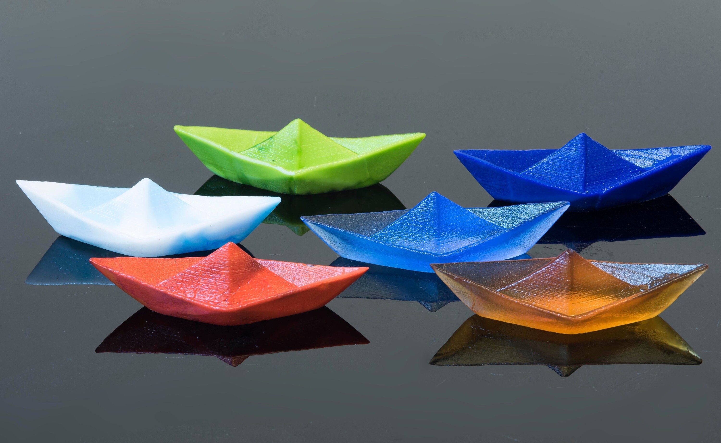 Paper boat in Murano glass. Realistic realization in glass.Sculpture of the glass master. Paper boat imitation. Paperweight glass made.