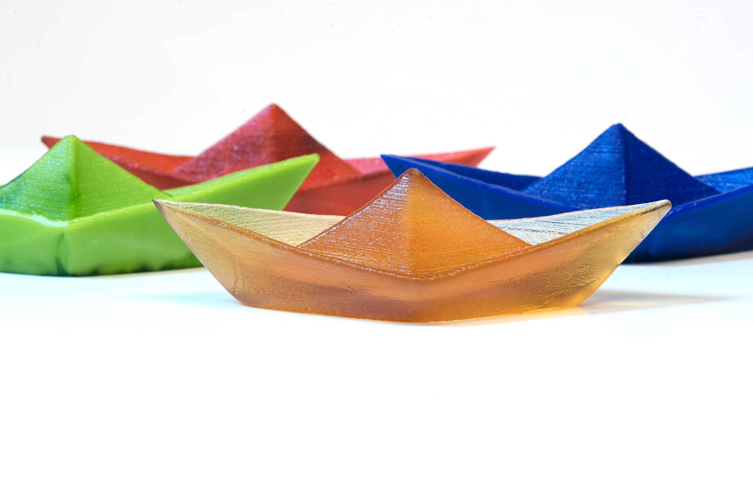 Paper boat in Murano glass. Realistic realization in glass.Sculpture of the glass master. Paper boat imitation. Paperweight glass made.