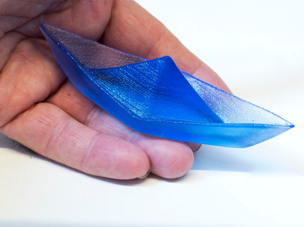 Paper boat in Murano glass. Realistic realization in glass.Sculpture of the glass master. Paper boat imitation. Paperweight glass made.